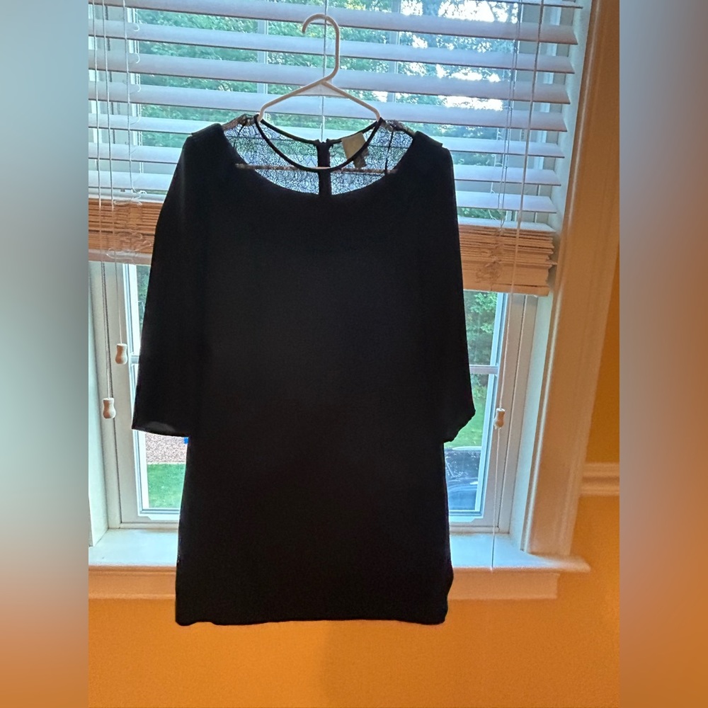 Black dress with lace neck.